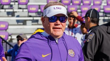 The authenticity issue of LSU coach Brian Kelly began with his "fake accent" and has escalated with a table slam and a statement from an ex-QB.