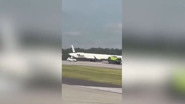 A video has emerged showing the tail of a Delta plane being severed after a collision while taxiing at the Atlanta airport.