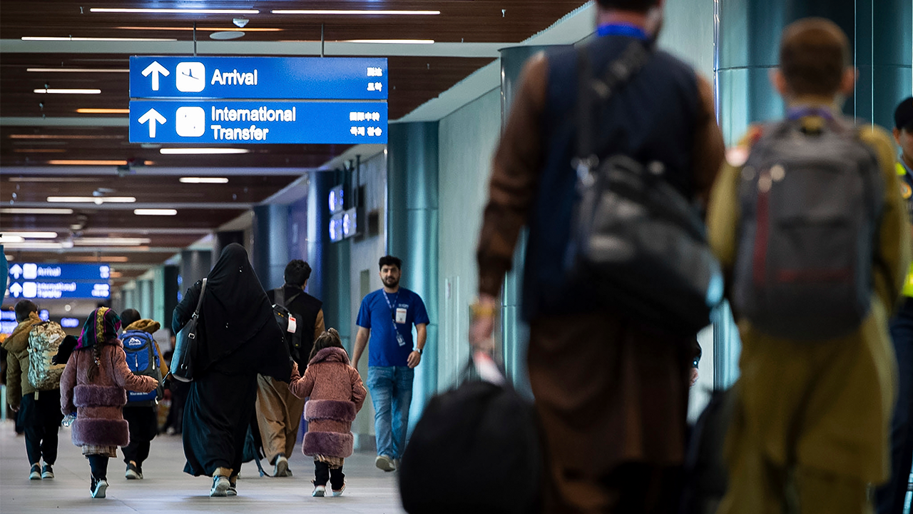 Filipinos process visas for Afghans before their resettlement in the US.