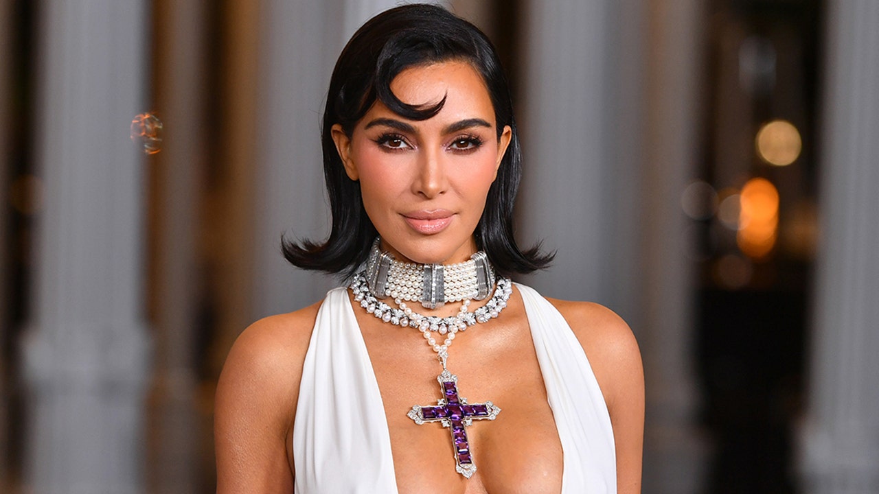 Kim Kardashian criticized for wearing rosary in revealing ad: "Your outfit is anything but sacred"