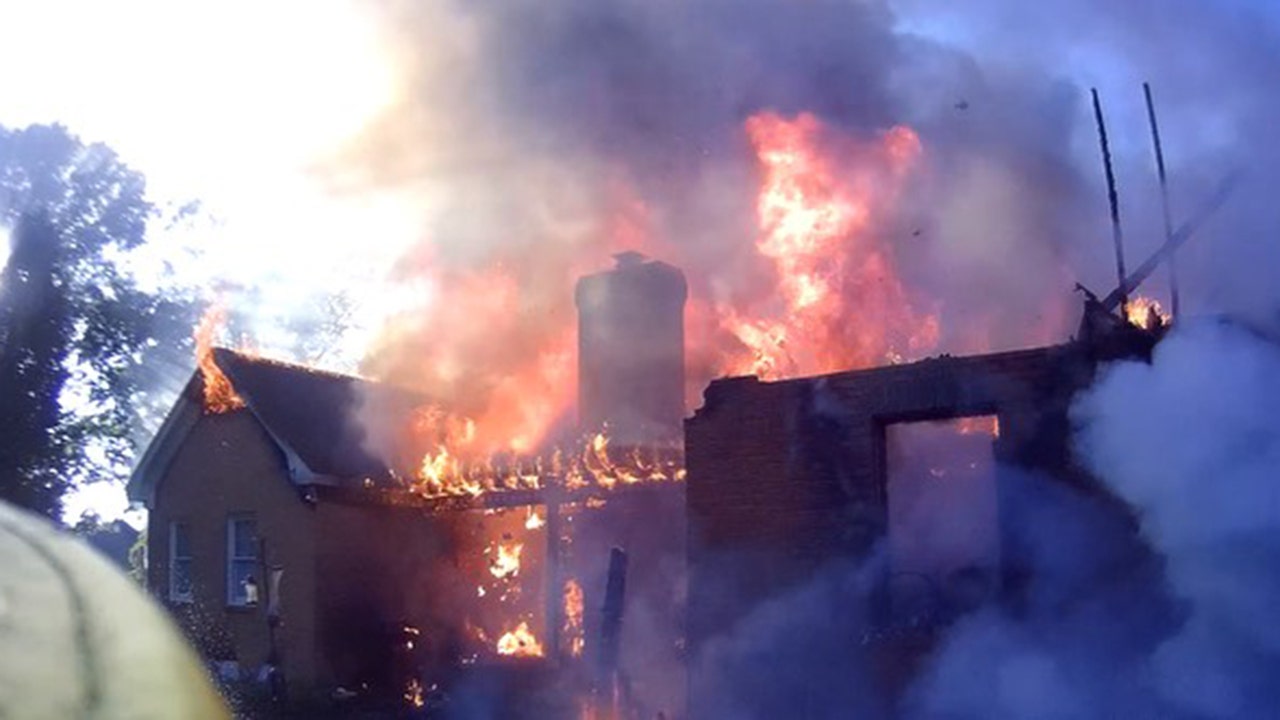 A Georgia passerby rescued a man from his burning home by breaking down the storm door.