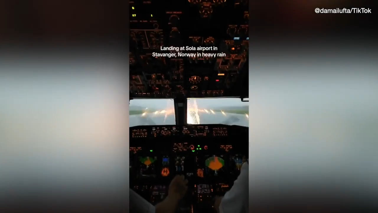 Video of flight attendant goes viral, showing pilots navigating through heavy rainstorm during landing.