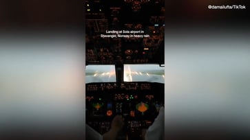 Video of flight attendant goes viral, showing pilots navigating through heavy rainstorm during landing.