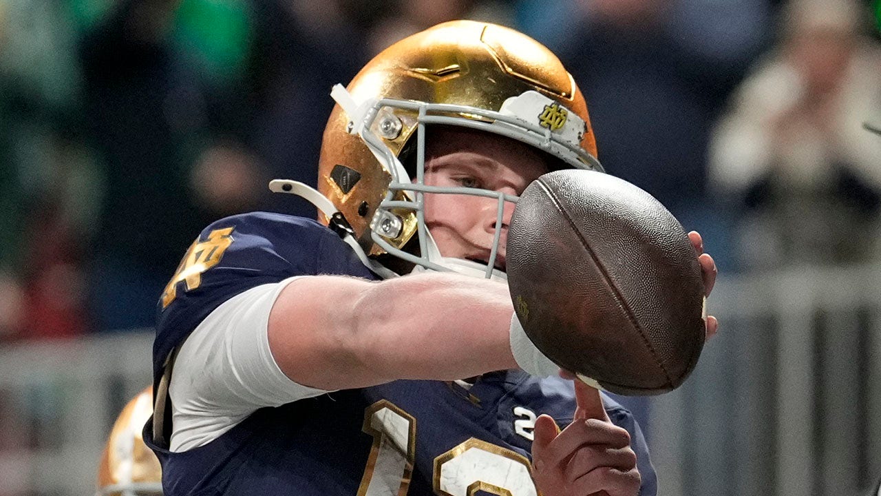 Riley Leonard of Notre Dame highlights his favorite Bible verse after scoring the first touchdown in the national championship game.