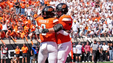 Oklahoma State narrowly escapes an upset by Arkansas in double overtime.