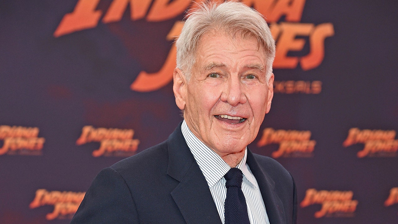 Harrison Ford, 82, says he should be 'sitting on my a--,' but loves working.