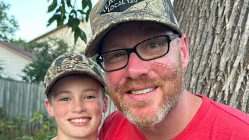 A young boy saves his father from a black bear attack using a rifle: 'A hero'