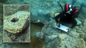 An unusual shipwreck, dating back 2,500 years, was discovered by divers off the coast of Sicily, containing a variety of mysterious artifacts.