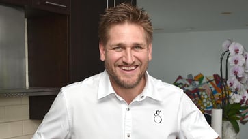 McDonald's supersized burger should have a health warning, says TV chef Curtis Stone.