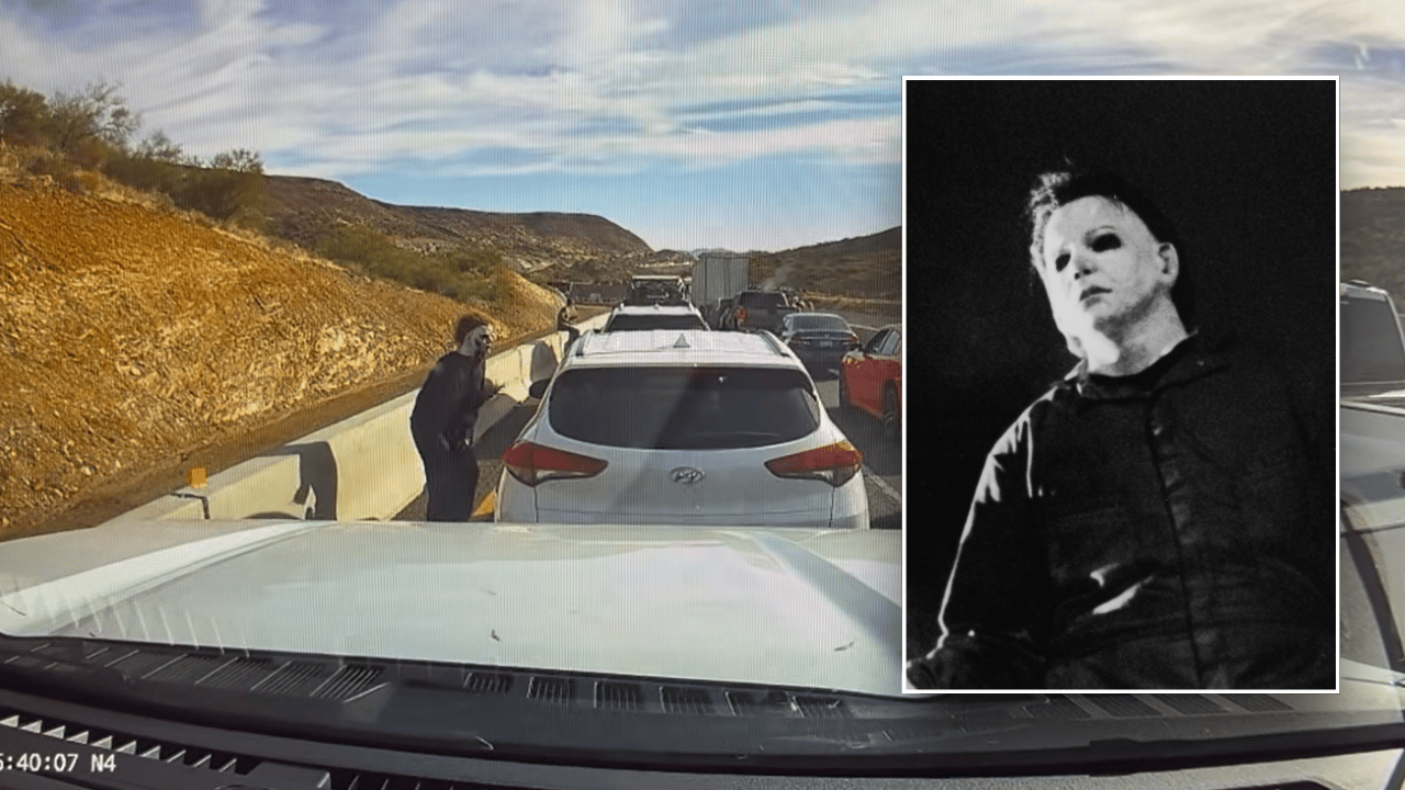 Video shows a man dressed as a Halloween villain scaring drivers in standstill traffic.