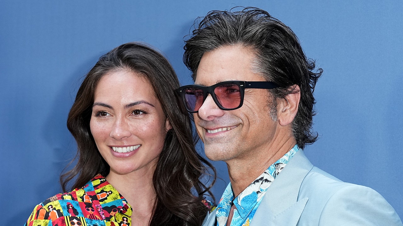 John Stamos' spouse quips that he "dated everyone else" before settling down with her.