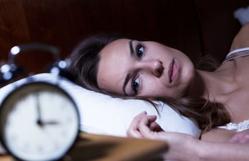 How can I stop racing thoughts at night that prevent me from sleeping?