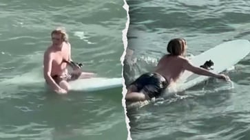 Video captures a heroic surfer rescuing a drowning bird in the waves.