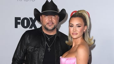 Jason Aldean's wife accuses "wokeness" of excluding her husband from the Billboard 100 greatest country artists of all time list.