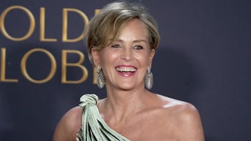 Sharon Stone's approach to maintaining a positive mindset amidst a near-fatal brain bleed and financial difficulties.