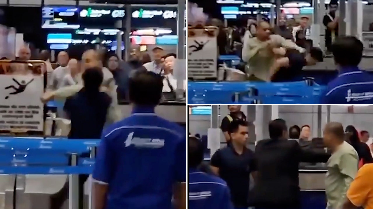 An irate traveler attacks an airport employee in a shocking video.