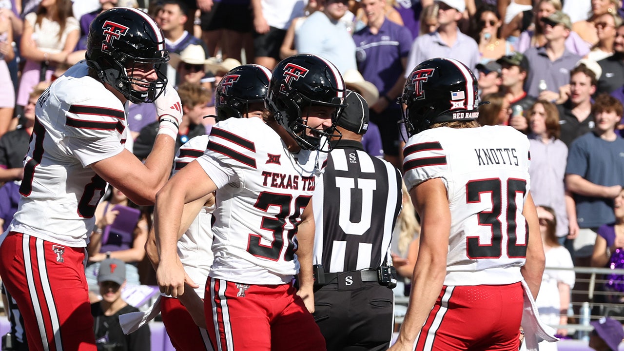 After scoring a touchdown on a trick play, a Texas Tech kicker displays ...