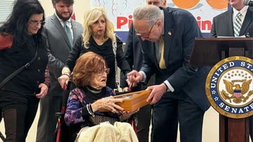 Schumer pays tribute to Holocaust survivor with Capitol flag and Senate recognition.