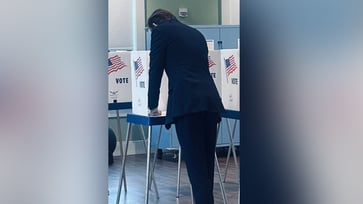 Melania Trump shares picture of Barron, 18, casting his first vote alongside his father in the election.