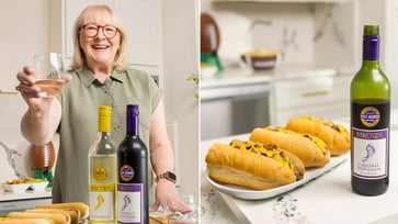 Travis Kelce's mom, Donna Kelce, reveals her go-to hot dog and wine pairing for the Super Bowl.