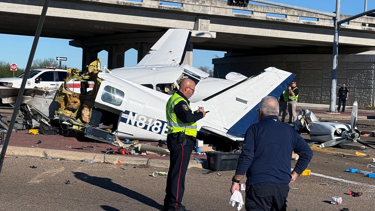 Video footage captures the aftermath of a small plane crash onto a Texas roadway with a split fuselage and damaged vehicles.