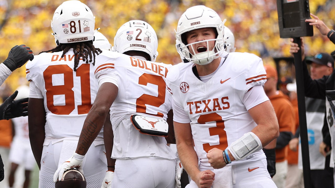 As Texas dominates Michigan, Quinn Ewers shines with three touchdown passes.