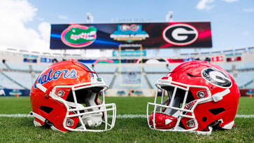 Fans and police in Jacksonville engage in chaotic brawls during the Florida-Georgia game, with one fan making a racial slur and threatening to kill another.