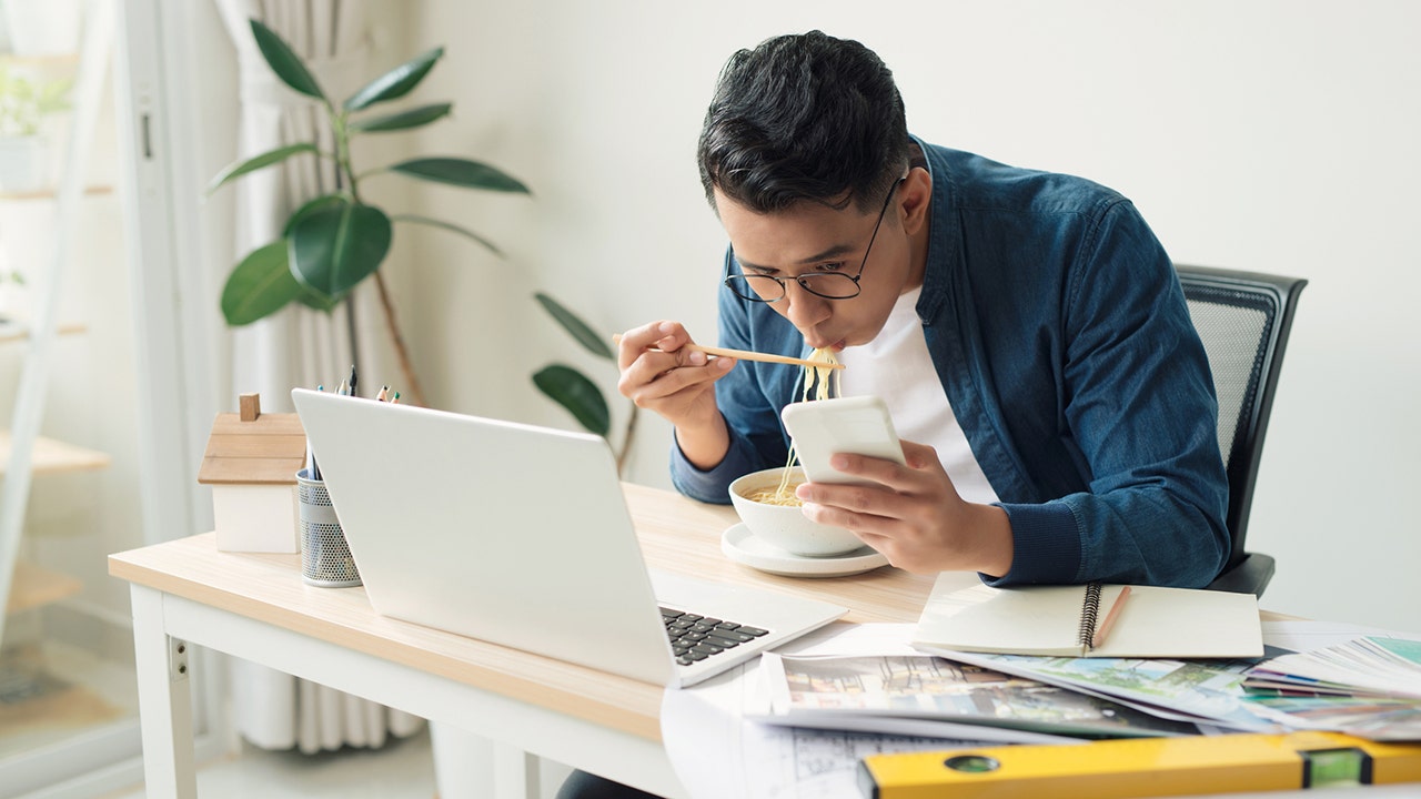 Experts unveil that eating lunch at your desk can have negative consequences, contrary to popular belief.