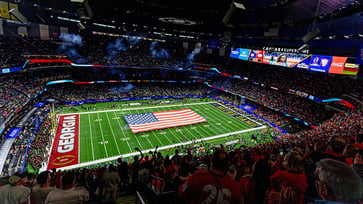 Fans at a college football game break into a chant of "U-S-A!" following a moment of silence for those affected by the New Orleans attack.