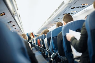 Passengers on an airplane were upset when a woman with a baby on her lap refused to move to a designated seat.