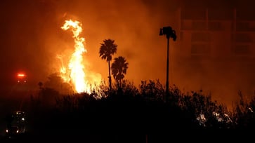 Students at Pepperdine University seek refuge in the library and campus center as a wildfire in Malibu prompts evacuations.