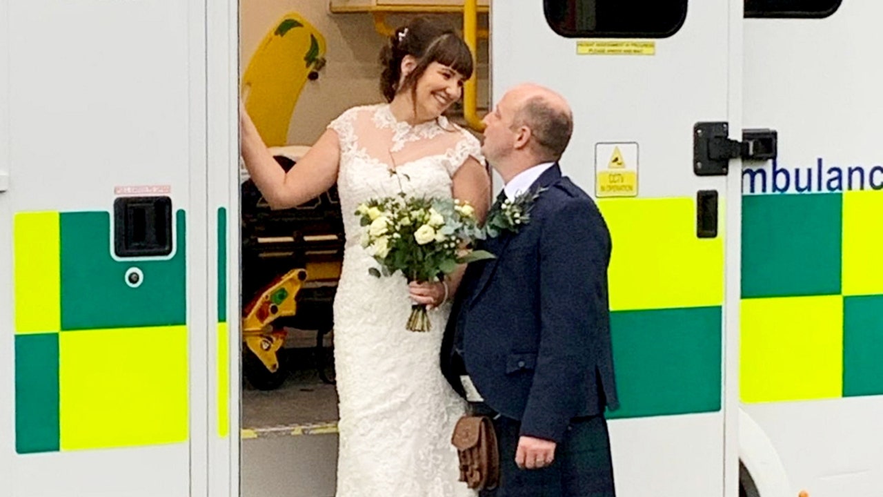 The wedding of paramedics took place with an ambulance as the backdrop, as they felt it was only right.