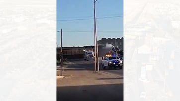 Video shows Texas train derailing after hitting tractor-trailer and crashing into city building.