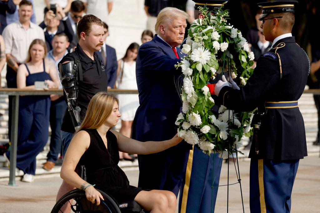 Amid altercation report, Trump honored fallen troops at Arlington National Cemetery with respect.