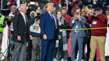 College football games in key swing states see DNC fly anti-Trump banners as Harris' poll numbers decline.