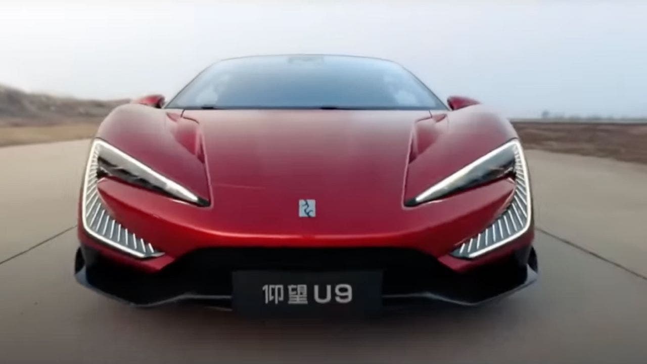 An electric hypercar from China successfully navigates obstacles such as spikes and potholes while autonomously driving.