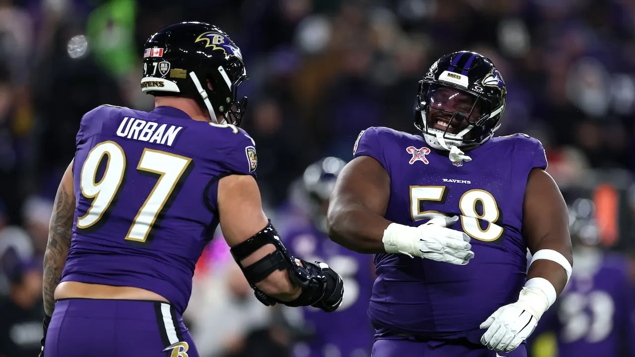 In the win against the Browns, the Ravens' 355-pound lineman makes a crucial interception to secure the division title.