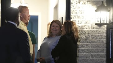 Pennsylvania family receives greeting from Harris on porch, proposes door-knocking event.