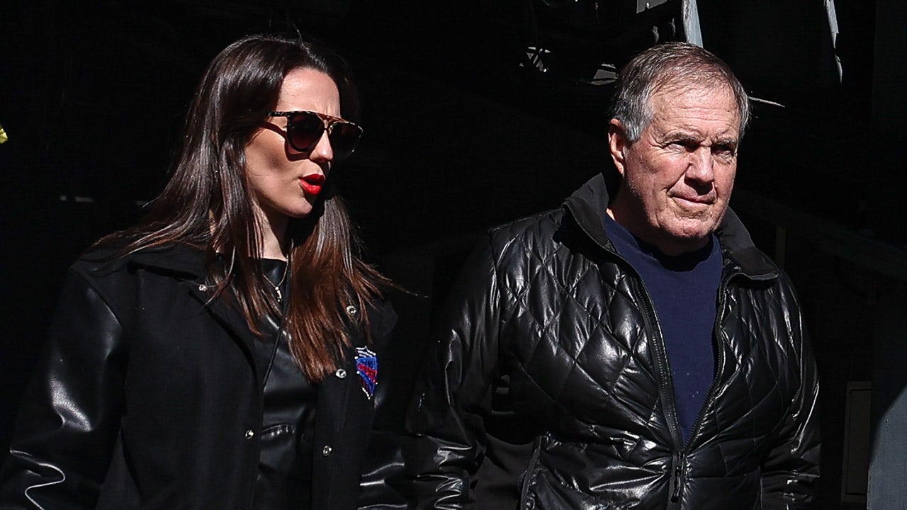 Bill Belichick's girlfriend appears to have put an end to rumors that the coach will leave North Carolina for the NFL.