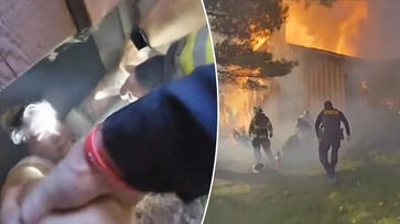 A woman in Ohio was rescued from a burning basement, as seen in a bodycam video.