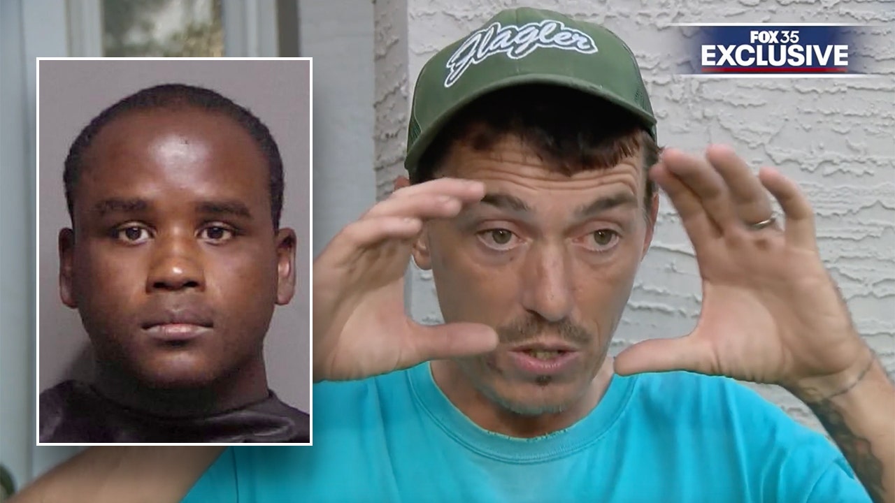 Florida father confronts suspected peeping Tom with a baseball bat in video footage: "I have something for you"