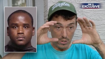 Florida father confronts suspected peeping Tom with a baseball bat in video footage: "I have something for you"