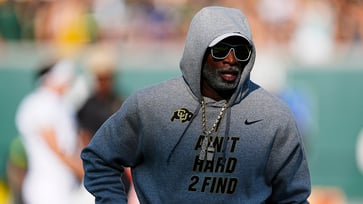 Deion Sanders criticizes reporters for being envious and jealous of players who earn more money.