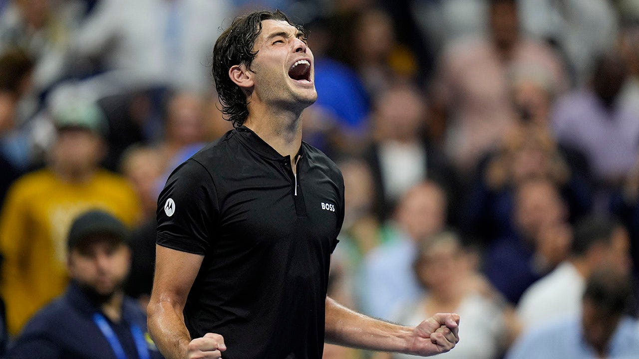 Taylor Fritz, an American player, aims to make history by reaching the US Open final after defeating Frances Tiafoe in a grueling match.