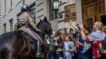 After an anti-Israel protest, UT Austin temporarily suspends its Pro-Palestinian student organization.