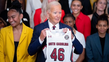 Biden criticizes men's college basketball for lower viewership than women's as champions visit White House.