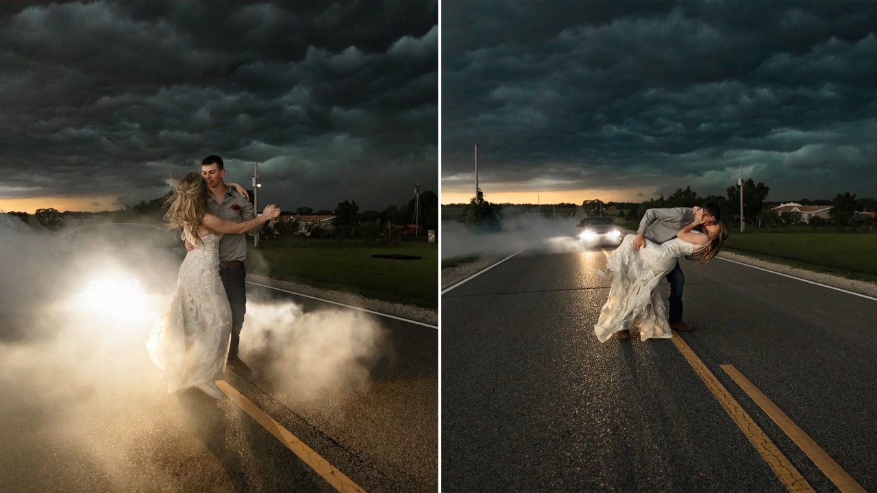 A dramatic thunderstorm serves as a breathtaking backdrop for the wedding photos of a Kansas photographer.