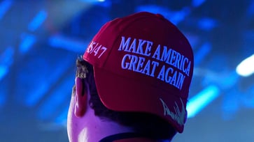 A California teacher confronts a student wearing a Trump hat on Election Day, demanding security to remove him.