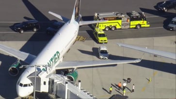 At Logan International Airport in Boston, Frontier planes accidentally clip their wings.