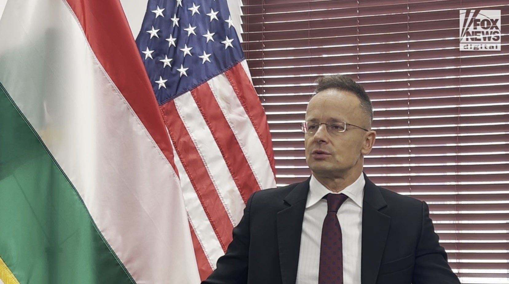 Hungarian Foreign Minister recalls positive experience with the Trump administration, stating that "our hope is all" on the former president.
